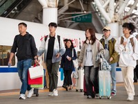 Passengers exit Nanjing Railway Station in Jiangsu province, China, on October 7, 2024. (