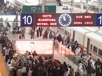 Passengers exit Nanjing Railway Station in Jiangsu province, China, on October 7, 2024. (