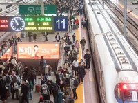 Passengers exit Nanjing Railway Station in Jiangsu province, China, on October 7, 2024. (