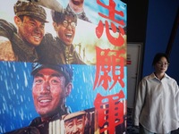 Visitors walk past a poster of the 2024 National Day movie at a cinema in Hangzhou, China, on October 7, 2024. (