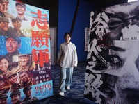 Visitors walk past a poster of the 2024 National Day movie at a cinema in Hangzhou, China, on October 7, 2024. (