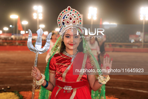 A participant performs 'Garba' during the Dainik Bhaskar Abhivyakti 'Garba Mahotsav' on the occasion of the Navratri festival in Jaipur, Raj...