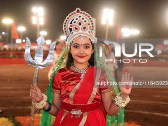 A participant performs 'Garba' during the Dainik Bhaskar Abhivyakti 'Garba Mahotsav' on the occasion of the Navratri festival in Jaipur, Raj...