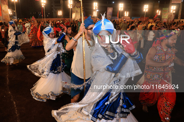 Participants perform 'Garba' during the Dainik Bhaskar Abhivyakti 'Garba Mahotsav' on the occasion of the Navratri festival in Jaipur, Rajas...