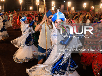 Participants perform 'Garba' during the Dainik Bhaskar Abhivyakti 'Garba Mahotsav' on the occasion of the Navratri festival in Jaipur, Rajas...