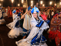 Participants perform 'Garba' during the Dainik Bhaskar Abhivyakti 'Garba Mahotsav' on the occasion of the Navratri festival in Jaipur, Rajas...