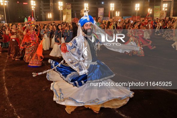 Participants perform 'Garba' during the Dainik Bhaskar Abhivyakti 'Garba Mahotsav' on the occasion of the Navratri festival in Jaipur, Rajas...