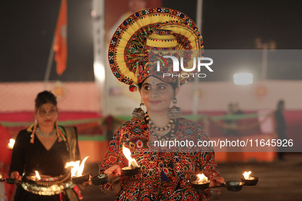 A participant performs 'Garba' during the Dainik Bhaskar Abhivyakti 'Garba Mahotsav' on the occasion of the Navratri festival in Jaipur, Raj...