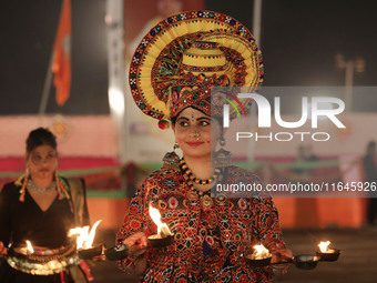 A participant performs 'Garba' during the Dainik Bhaskar Abhivyakti 'Garba Mahotsav' on the occasion of the Navratri festival in Jaipur, Raj...