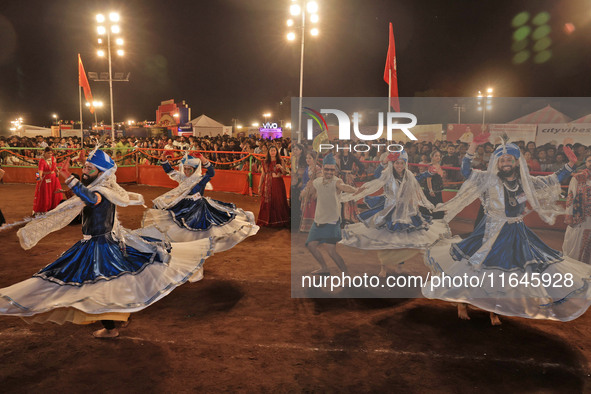 Participants perform 'Garba' during the Dainik Bhaskar Abhivyakti 'Garba Mahotsav' on the occasion of the Navratri festival in Jaipur, Rajas...