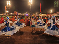 Participants perform 'Garba' during the Dainik Bhaskar Abhivyakti 'Garba Mahotsav' on the occasion of the Navratri festival in Jaipur, Rajas...