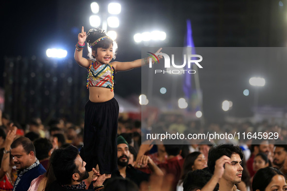 A little girl performs 'Garba' during the Dainik Bhaskar Abhivyakti 'Garba Mahotsav' on the occasion of the Navratri festival in Jaipur, Raj...