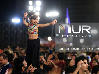 A little girl performs 'Garba' during the Dainik Bhaskar Abhivyakti 'Garba Mahotsav' on the occasion of the Navratri festival in Jaipur, Raj...