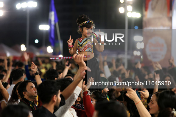 A little girl performs 'Garba' during the Dainik Bhaskar Abhivyakti 'Garba Mahotsav' on the occasion of the Navratri festival in Jaipur, Raj...