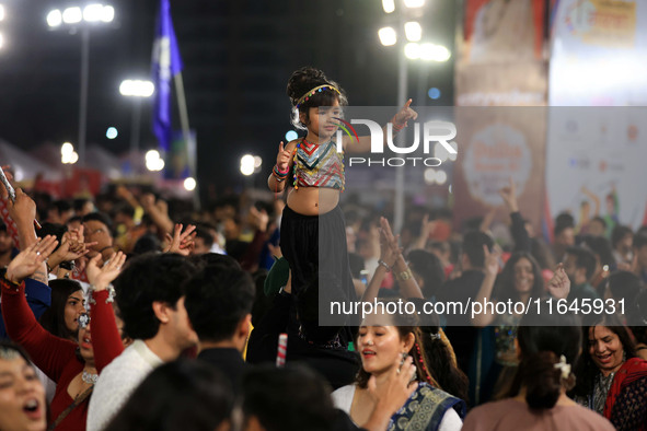 A little girl performs 'Garba' during the Dainik Bhaskar Abhivyakti 'Garba Mahotsav' on the occasion of the Navratri festival in Jaipur, Raj...