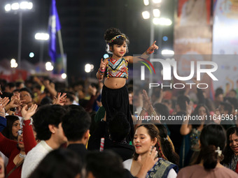 A little girl performs 'Garba' during the Dainik Bhaskar Abhivyakti 'Garba Mahotsav' on the occasion of the Navratri festival in Jaipur, Raj...