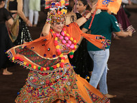 A participant performs 'Garba' during the Dainik Bhaskar Abhivyakti 'Garba Mahotsav' on the occasion of the Navratri festival in Jaipur, Raj...