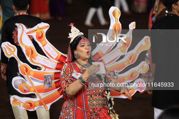 A participant performs 'Garba' during the Dainik Bhaskar Abhivyakti 'Garba Mahotsav' on the occasion of the Navratri festival in Jaipur, Raj...