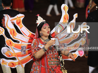 A participant performs 'Garba' during the Dainik Bhaskar Abhivyakti 'Garba Mahotsav' on the occasion of the Navratri festival in Jaipur, Raj...