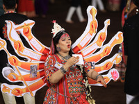 A participant performs 'Garba' during the Dainik Bhaskar Abhivyakti 'Garba Mahotsav' on the occasion of the Navratri festival in Jaipur, Raj...