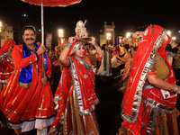 Participants perform 'Garba' during the Dainik Bhaskar Abhivyakti 'Garba Mahotsav' on the occasion of the Navratri festival in Jaipur, Rajas...