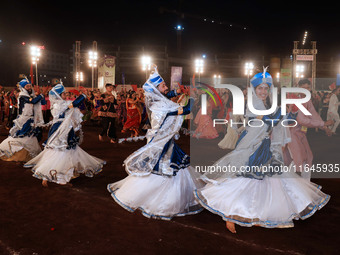 Participants perform 'Garba' during the Dainik Bhaskar Abhivyakti 'Garba Mahotsav' on the occasion of the Navratri festival in Jaipur, Rajas...