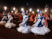 Participants perform 'Garba' during the Dainik Bhaskar Abhivyakti 'Garba Mahotsav' on the occasion of the Navratri festival in Jaipur, Rajas...