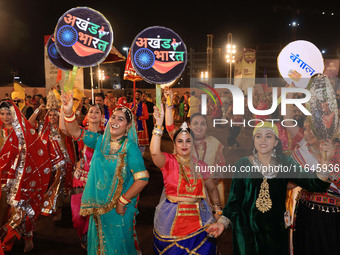 Participants perform 'Garba' during the Dainik Bhaskar Abhivyakti 'Garba Mahotsav' on the occasion of the Navratri festival in Jaipur, Rajas...