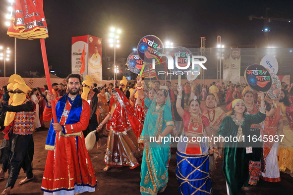 Participants perform 'Garba' during the Dainik Bhaskar Abhivyakti 'Garba Mahotsav' on the occasion of the Navratri festival in Jaipur, Rajas...