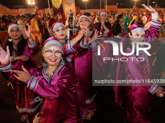 Participants perform 'Garba' during the Dainik Bhaskar Abhivyakti 'Garba Mahotsav' on the occasion of the Navratri festival in Jaipur, Rajas...