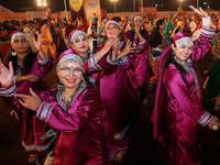 Participants perform 'Garba' during the Dainik Bhaskar Abhivyakti 'Garba Mahotsav' on the occasion of the Navratri festival in Jaipur, Rajas...