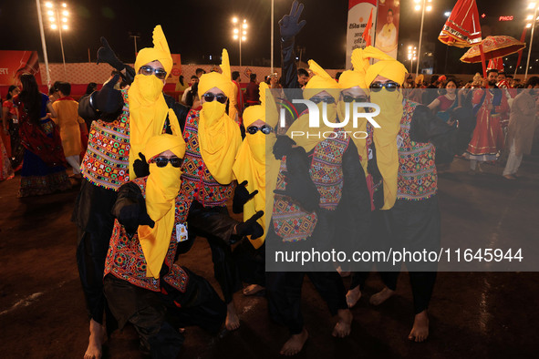 Participants perform 'Garba' during the Dainik Bhaskar Abhivyakti 'Garba Mahotsav' on the occasion of the Navratri festival in Jaipur, Rajas...