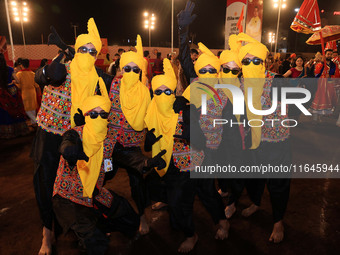 Participants perform 'Garba' during the Dainik Bhaskar Abhivyakti 'Garba Mahotsav' on the occasion of the Navratri festival in Jaipur, Rajas...