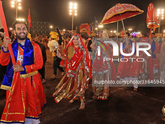 Participants perform 'Garba' during the Dainik Bhaskar Abhivyakti 'Garba Mahotsav' on the occasion of the Navratri festival in Jaipur, Rajas...