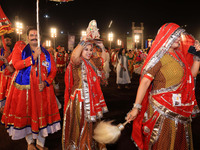 Participants perform 'Garba' during the Dainik Bhaskar Abhivyakti 'Garba Mahotsav' on the occasion of the Navratri festival in Jaipur, Rajas...