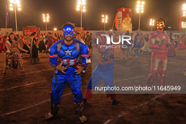 Participants perform 'Garba' during the Dainik Bhaskar Abhivyakti 'Garba Mahotsav' on the occasion of the Navratri festival in Jaipur, Rajas...