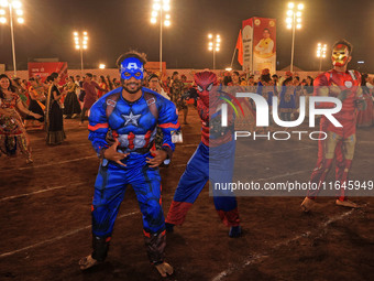 Participants perform 'Garba' during the Dainik Bhaskar Abhivyakti 'Garba Mahotsav' on the occasion of the Navratri festival in Jaipur, Rajas...