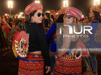 Participants perform 'Garba' during the Dainik Bhaskar Abhivyakti 'Garba Mahotsav' on the occasion of the Navratri festival in Jaipur, Rajas...