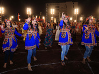 Participants perform 'Garba' during the Dainik Bhaskar Abhivyakti 'Garba Mahotsav' on the occasion of the Navratri festival in Jaipur, Rajas...