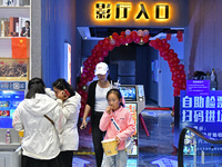 People watch a movie at China Film Digital International Cinema in the Fushan district of Yantai city, East China's Shandong province, on Oc...