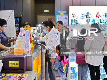 People buy tickets at the China Film Digital International Cinema in the Fushan district of Yantai, China, on October 7, 2024. (