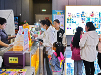 People buy tickets at the China Film Digital International Cinema in the Fushan district of Yantai, China, on October 7, 2024. (