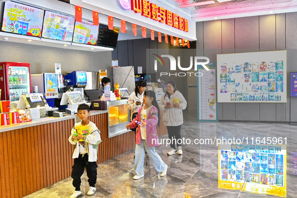 People buy snacks at the China Film Digital International Cinema in the Fushan district of Yantai, China, on October 7, 2024. 