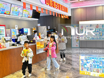 People buy snacks at the China Film Digital International Cinema in the Fushan district of Yantai, China, on October 7, 2024. (