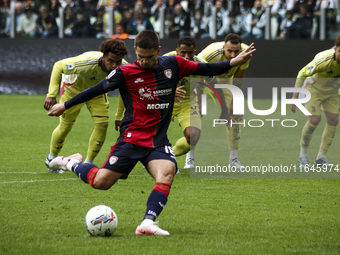 Cagliari midfielder Razvan Marin (18) scores his goal to make it 1-1 by penalty kick during the Serie A football match number 7, Juventus vs...