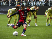 Cagliari midfielder Razvan Marin (18) scores his goal to make it 1-1 by penalty kick during the Serie A football match number 7, Juventus vs...