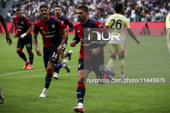 Cagliari midfielder Razvan Marin (18) celebrates after scoring his goal to make it 1-1 during the Serie A football match number 7, Juventus...