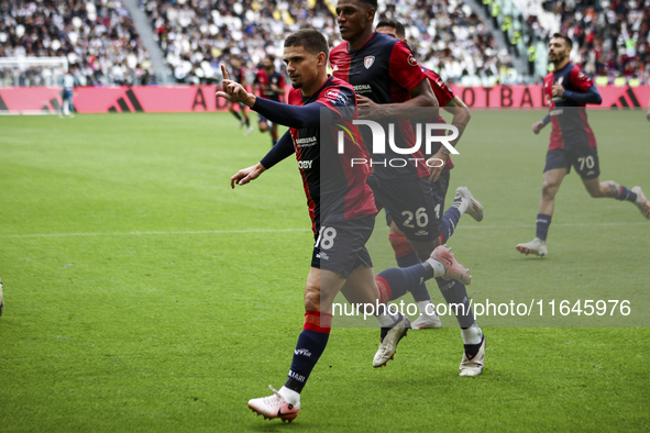 Cagliari midfielder Razvan Marin (18) celebrates after scoring his goal to make it 1-1 during the Serie A football match number 7, Juventus...