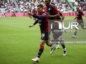 Cagliari midfielder Razvan Marin (18) celebrates after scoring his goal to make it 1-1 during the Serie A football match number 7, Juventus...