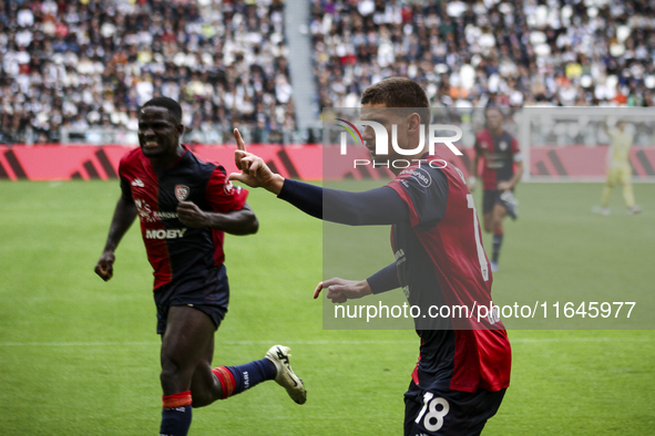 Cagliari midfielder Razvan Marin (18) celebrates after scoring his goal to make it 1-1 during the Serie A football match number 7, Juventus...